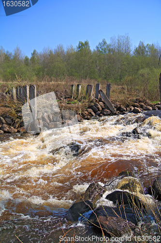 Image of river flow on old destroyed dam
