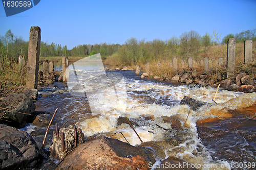 Image of river flow on old destroyed dam