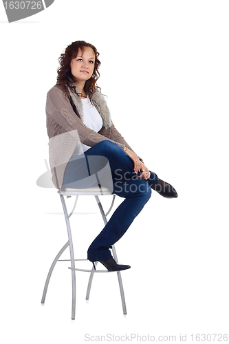 Image of Girl sitting on the bar chair