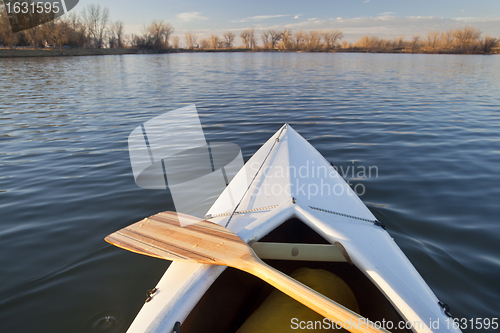Image of canoe bow and paddle