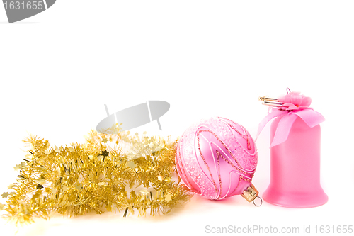 Image of golden tinsel with pink glass decoration