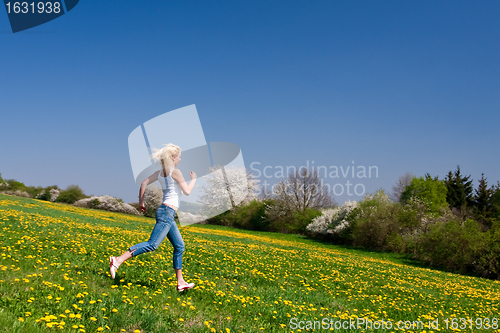 Image of happy young woman on meadow
