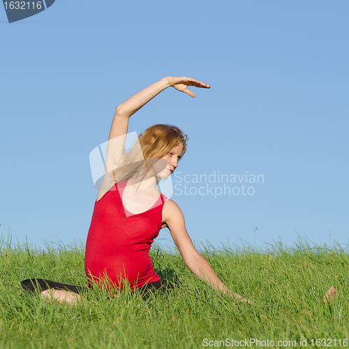 Image of pregnant woman on meadow