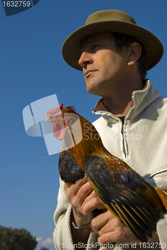 Image of man and chicken
