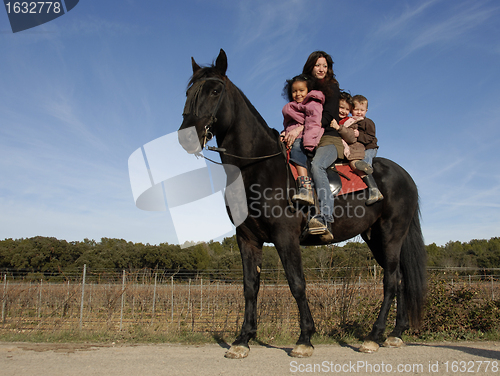 Image of riding family