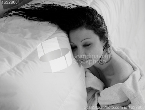 Image of smiling woman in bathrobe