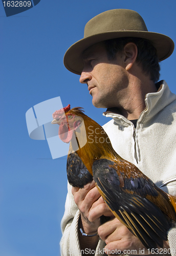 Image of man and rooster