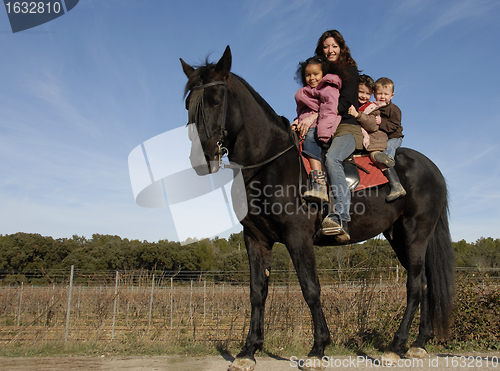 Image of riding family