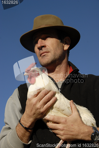 Image of man and chicken
