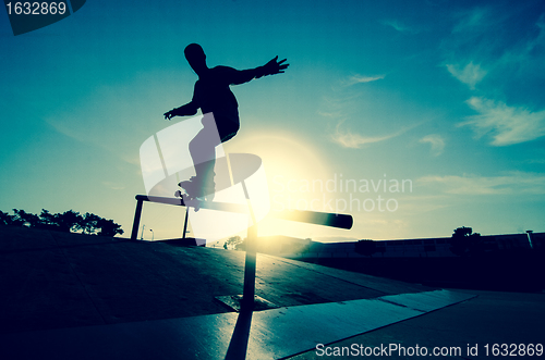 Image of Skateboarder silhouette on a grind
