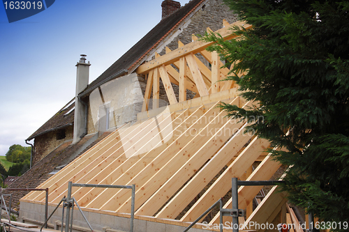 Image of construction of the wooden frame of a roof