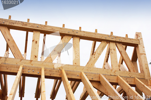 Image of construction of the wooden frame of a roof