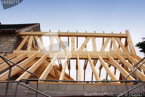 Image of construction of the wooden frame of a roof