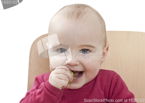 Image of child in red shirt eating