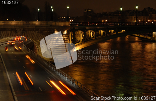 Image of traffic in Paris at night