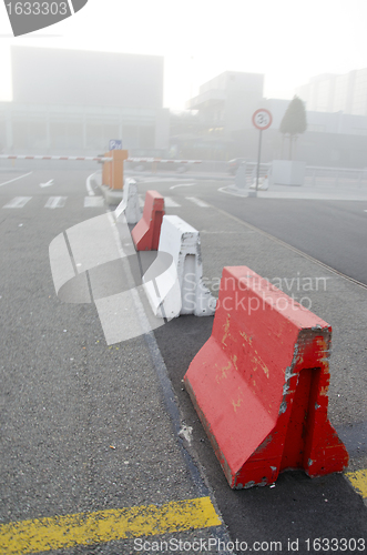 Image of city in morning fog. concrete lower road barriers 