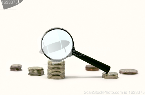 Image of Magnifier on pile of coins