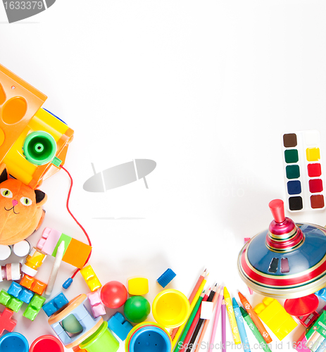 Image of children's toys scattered on a white sheet