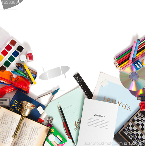 Image of school supplies are scattered on a white sheet