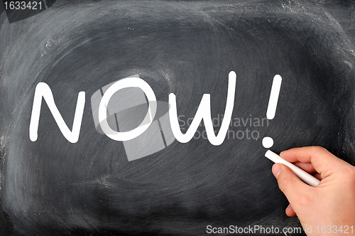 Image of Now written on a blackboard background