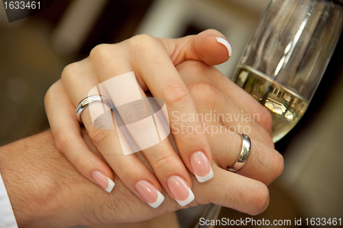 Image of bride groom holding hands