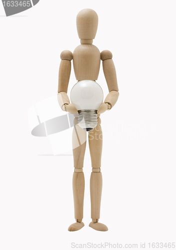 Image of Wooden mannequin holding lamp