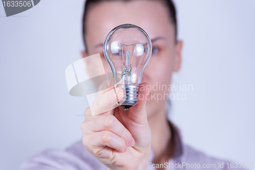 Image of woman holding lamp