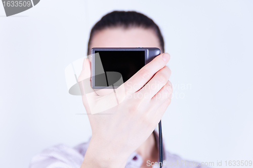 Image of woman photographed herself camera without face