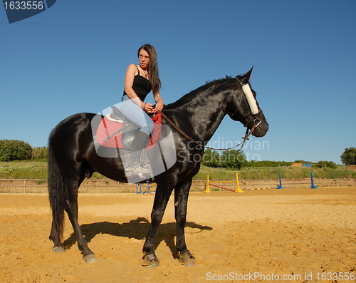 Image of horse and woman in dressage