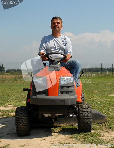 Image of man and lauwn mower