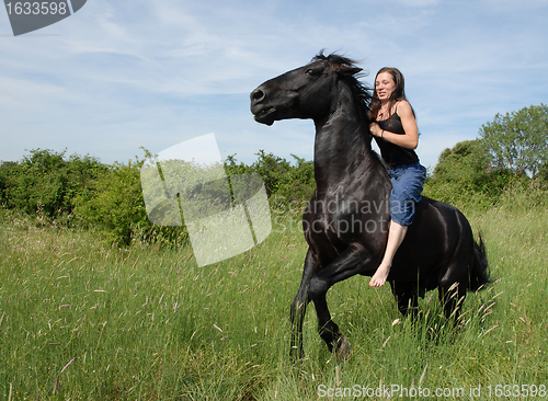 Image of young woman and horse