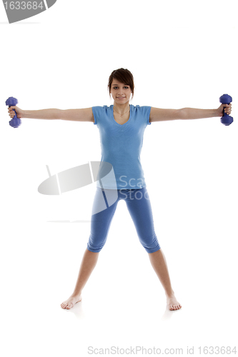 Image of Beautiful girl with dumbbells