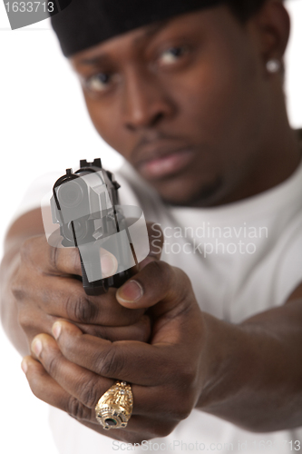 Image of Young thug with a gun