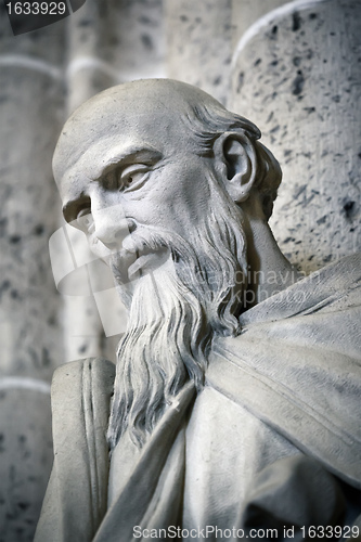 Image of male face in stone