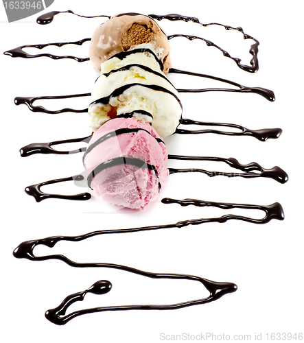 Image of Tricolor scoops on a row with melted chocolate lines