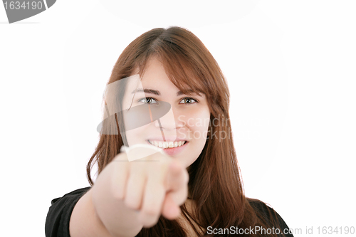 Image of Portrait of a young smiling businesswoman pointing at you. Isola