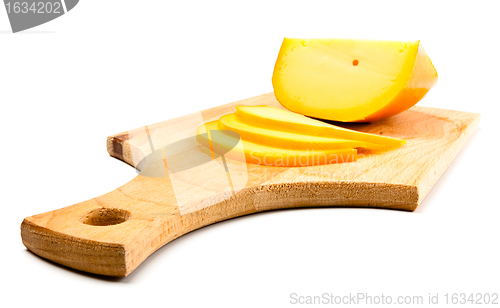 Image of cheese slices on cutting board