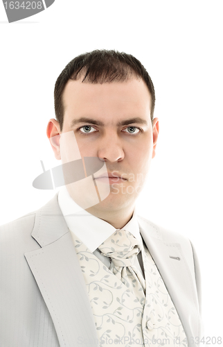 Image of serious young man in wedding suit portrait