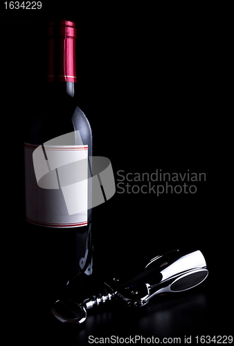 Image of bottle of wine and corkscrew
