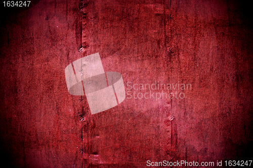 Image of metal painted crimson wall texture