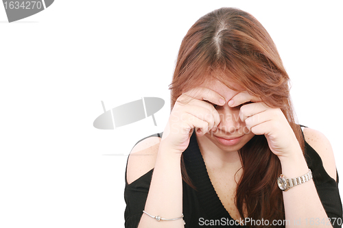 Image of Young business woman looking worried at desk on white background