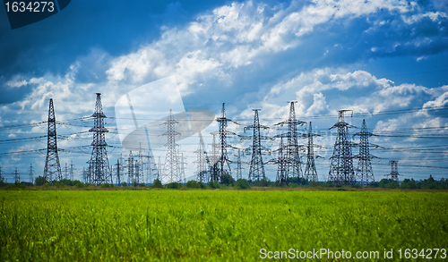 Image of summer meadow with high-voltage towers