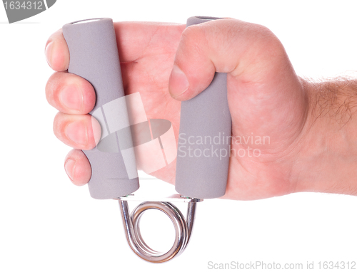 Image of hand with spring trainer