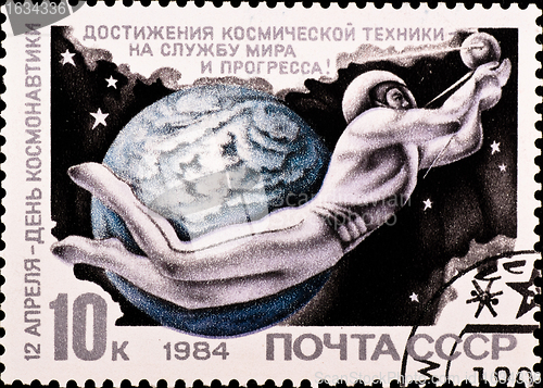 Image of postage stamp shows man flying in space