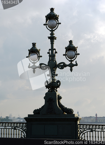 Image of vintage street lamp on embankment