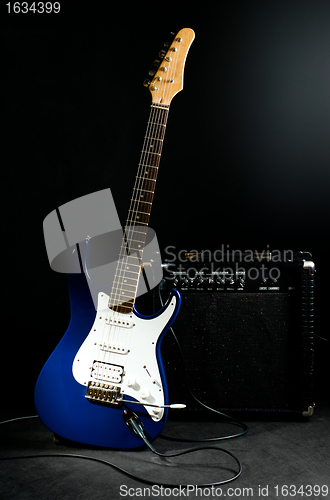 Image of electric guitar and combo amplifier