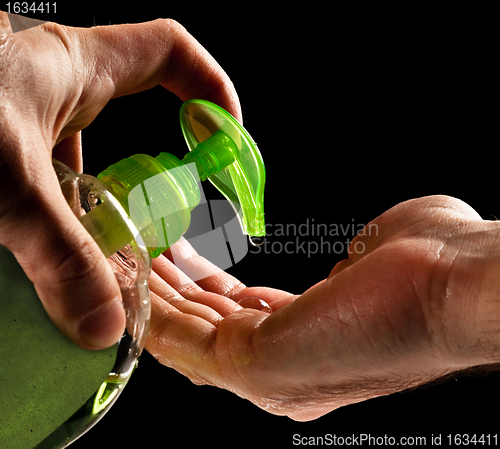 Image of washing hands with liquid soap