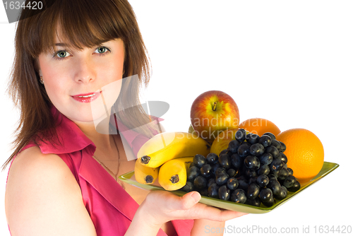 Image of beautiful girl with dish of fruits