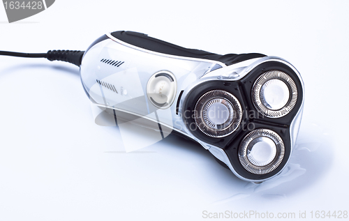 Image of electric shaver on grey background