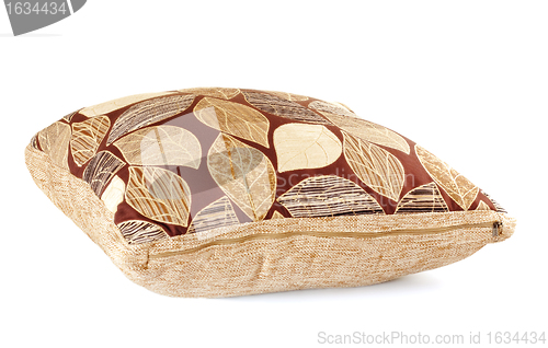 Image of brown pillow with leaves pattern